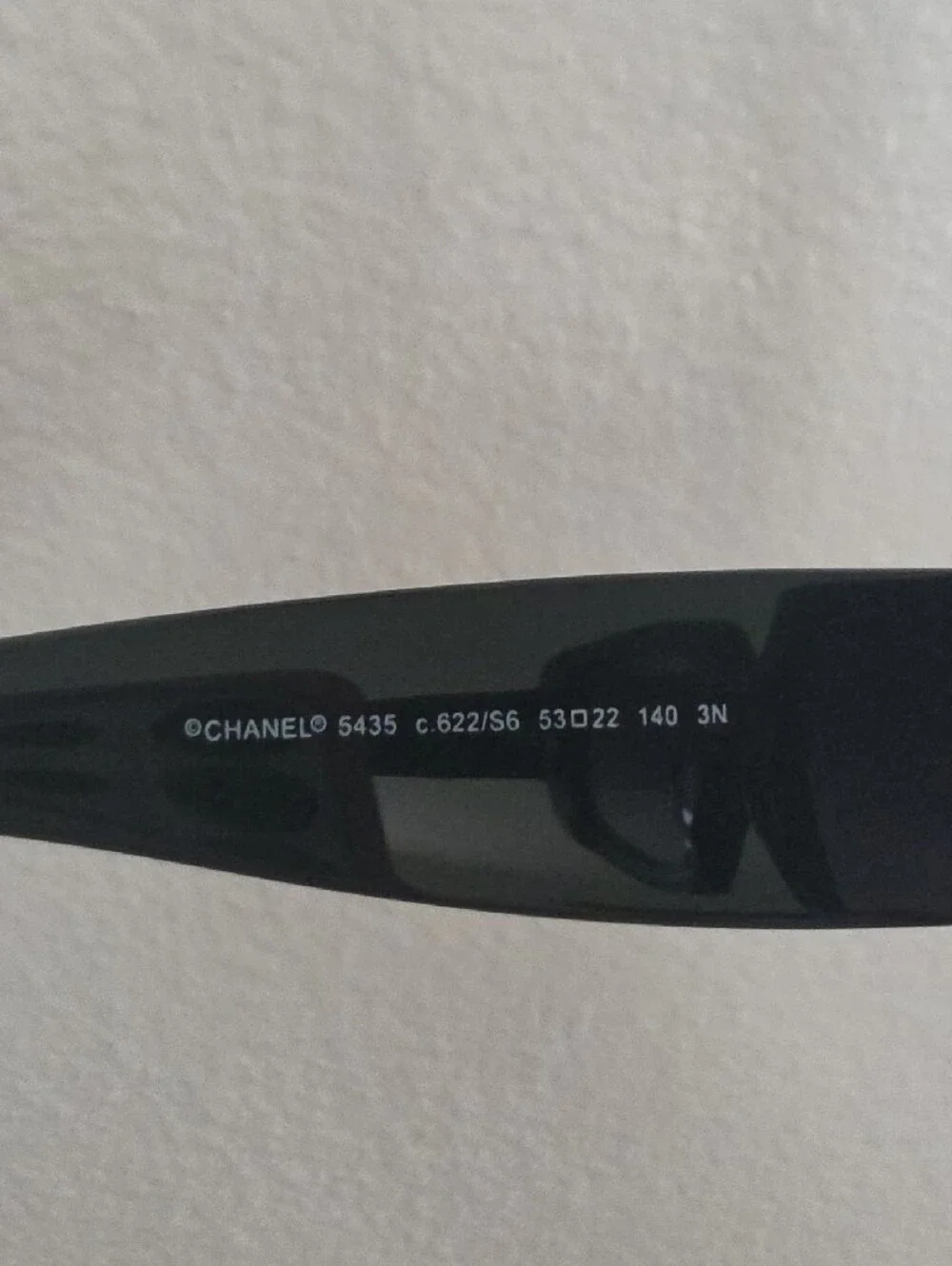 CHANEL Black Frame Sunglasses with Gold Accents and Gradient Purple Lenses